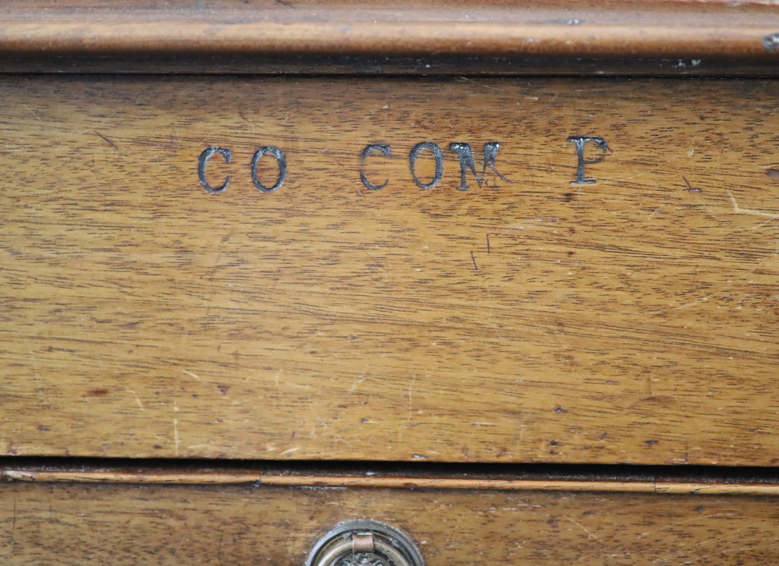 Royal furniture. A William IV mahogany bedside cupboard combined writing chest, H 77cm. W 58cm. D 42cm.